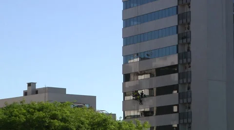 Workers Rappelling And Washing Windows on Building in Brazil Video stock 60649287