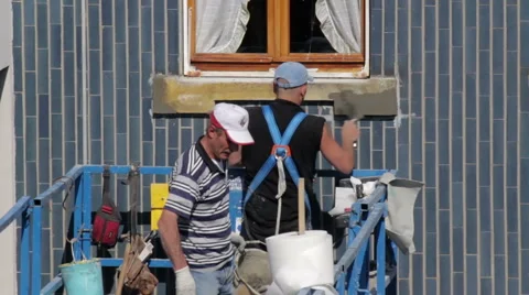 Workers rebuild a window sill of an elevator Stock Footage 49390412