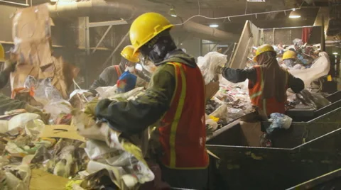 WORKERS RECYCLE ON SORTING PLATFORM 2 Stock Footage 6529916
