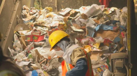 WORKERS RECYCLE ON SORTING PLATFORM Stock Footage 6530040