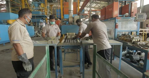 Workers Removing Battery Separators from Industrial Conveyor Belt (4K) Stock Footage 60787501