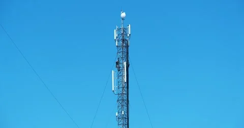 Workers repair a cell tower. High-altitude work. Workmen at the work Stock Footage 308652864