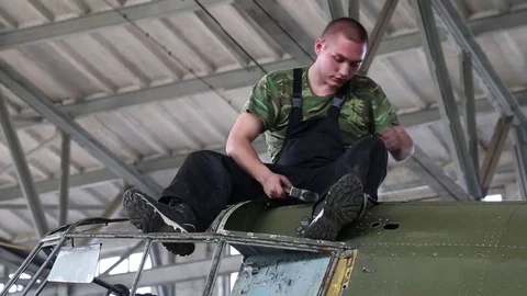 Workers repair the engine in the workshop. Stock Footage 81205853