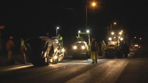 Workers repairing a road at night Stock Footage 46800239