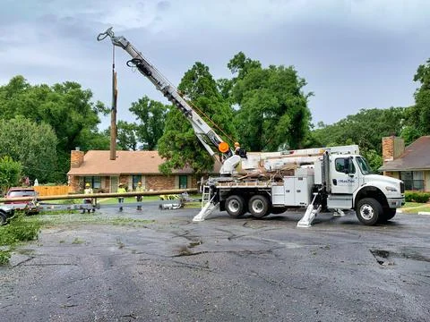 Workers replacing a power pole Stock Photos