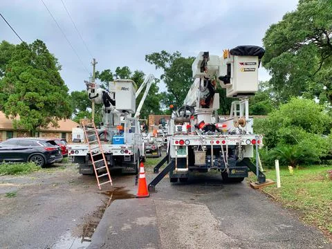 Workers replacing a power pole Stock Photos