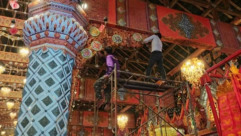 Workers Restoring Ornate Ceiling Carvings In Thai Temple Stock-Footage 338354334