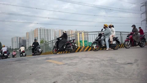 Workers-riding-on-overpass-into-bac-ninh-industrial-park Stock Footage 340471872