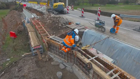 Workers on a Road - Construction Site - Close Aerial View 4K Stock Footage 87235787