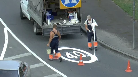 Workers on the road draw traffic sign Stock Footage 95325928