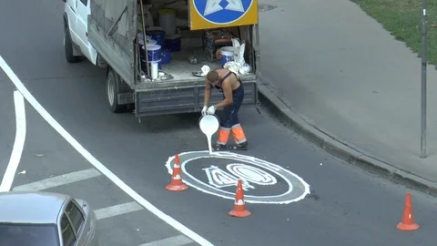 Workers on the road draw traffic sign Stock Footage 95325991