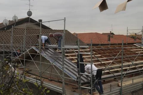 Workers on a roof Stock Photos