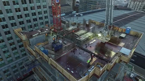 Workers on a rooftop in a city Stock Footage 64146510