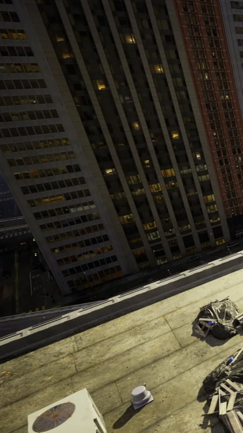 Workers on a rooftop in a city at night with buildings in the background Stock Footage 336582659