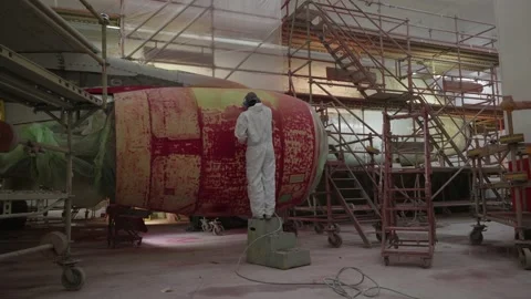 Workers Sanding Airbus a320 Engine In A Hangar Paintshop Stock Footage 231648406