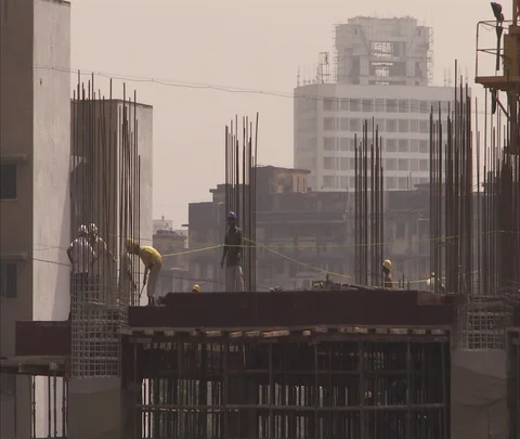 Workers on scaffolding at construction site Stock Footage 86741538