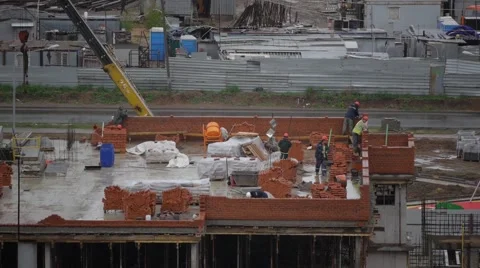 Workers on scaffolding at the side of a building 스톡 동영상 50071146