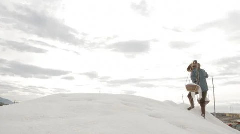 Workers Scale Salt Hill and Dumps Salt Stock Footage 42420324