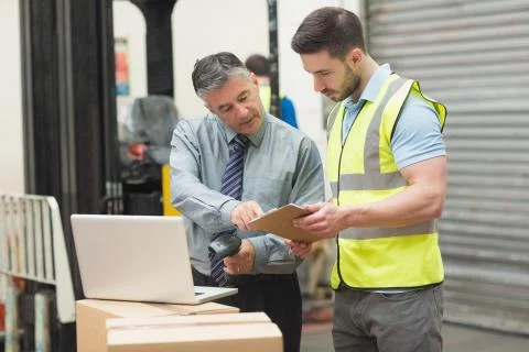 Workers scanning package in warehouse Stock Illustration