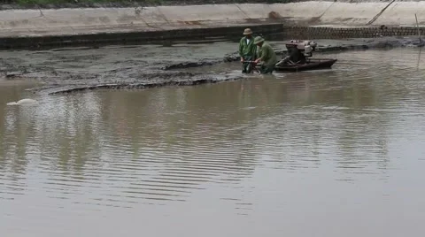 Workers scooped mud in lake Stock Footage 58625633