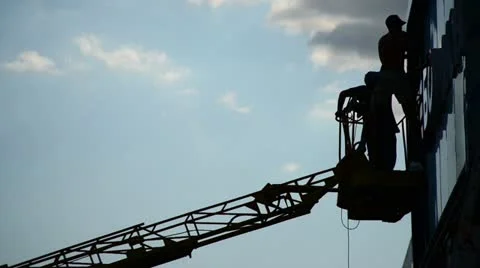 Workers set an advertising signboard on the facade of building. Fast motion Stock Footage 11412905