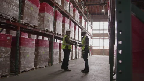 Workers Shake Hands In Warehouse Video stock 222005184