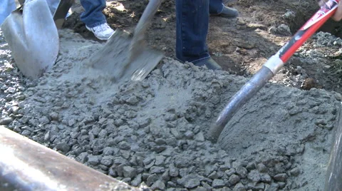 Workers shoveling concrete  2 Stock Footage 57673308