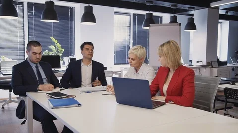 Workers sitting in office and making brainstorming research Stock Footage 119411428