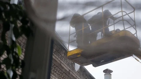 Workers in skylift Stock Footage 72127241