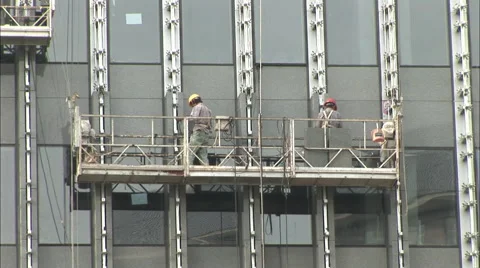 Workers on skyscraper construction elevator Stock Footage 56603484