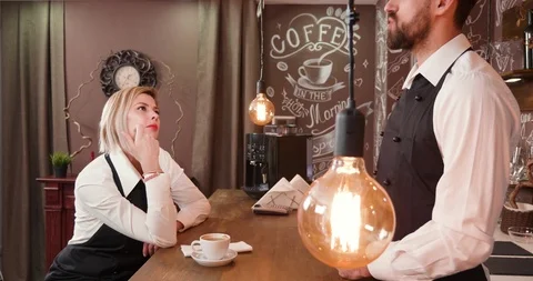 Workers of a small coffee shop waiting for customers Stock Footage 104863793