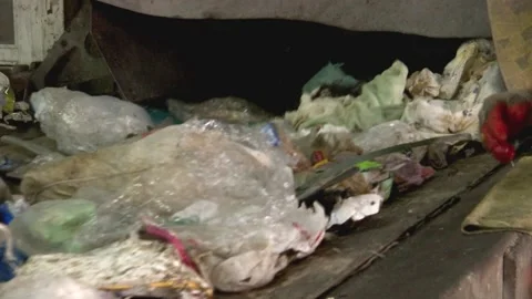 Workers sort garbage, waste for recycling at a recycling plant. Environment Vídeos de archivo 158885629