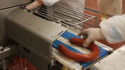 Workers sorting and packing dry meat in the food factory. Packaging of dry meat  Stock Footage 85486155