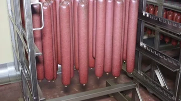 Workers sorting and packing dry meat in the food factory. Packaging of dry meat  Stock Footage 85486979
