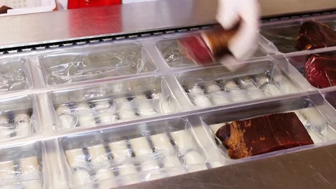 Workers sorting and packing dry meat in the food factory. Packaging of dry meat  Stock Footage 85487229