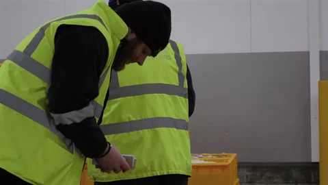 Workers Sorting Fish at Lerwick Fish Market - 4 May 2025 Stock Footage 344682200