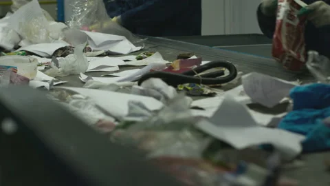 Workers sorting garbage on the conveyor of the waste processing plant. Stock Footage 99931350