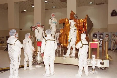 Workers in the Space Assembly and Encapsulation Building 2 prepare to move the Stock Photos
