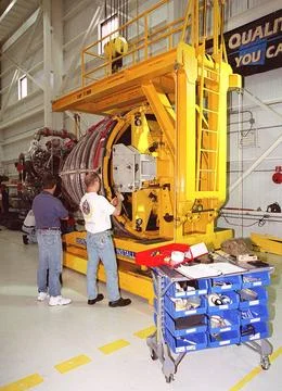 Workers in the Space Shuttle Main Engine Processing Facility get a new Spa... Stock Photos