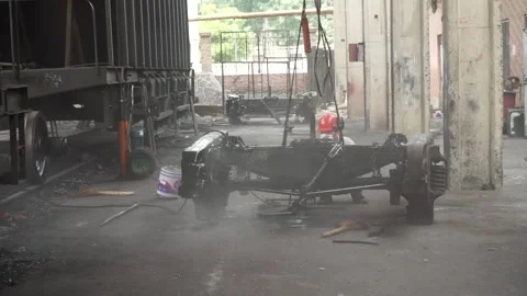 Workers spray paint on the train vehicle chassis Stock Footage 150715033