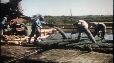 Workers spread concrete for floor on new home 1950s vintage film home movie 1880 Vidéo 47862279