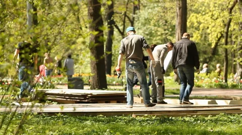 Workers in the spring park. Video stock 58312201
