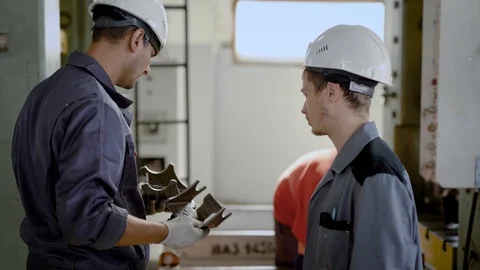 Workers standing in workshop of factory Stock Footage 95021621