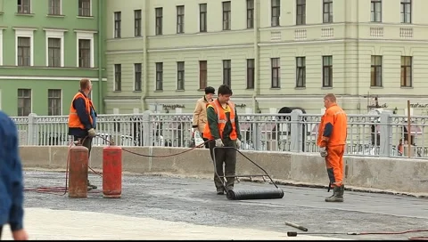 Workers stick waterproofing Stock Footage 5097174