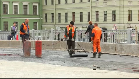 Workers stick waterproofing Stock Footage 5101152