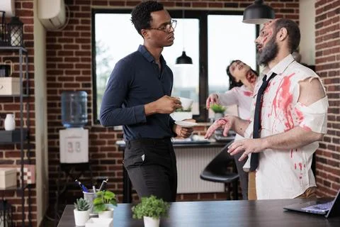 Workers stressed by overworking turning them into zombies ask boss for off days Stock Photos