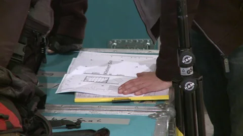 Workers studying a scheme Stock Footage 60840893