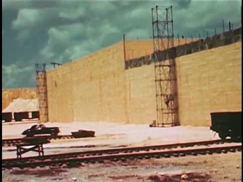 Workers at a sulphur plant use dynamite to break up the large solidified blocks Stock Footage 74946601