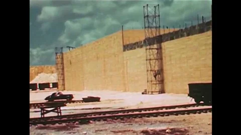 Workers at a sulphur plant use dynamite to break up the large solidified blocks Stock Footage 137250316
