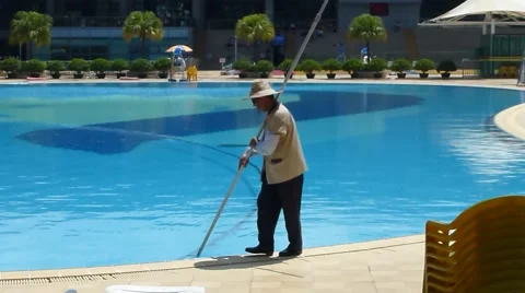 Workers swimming pool cleaning Stock Footage 65105709